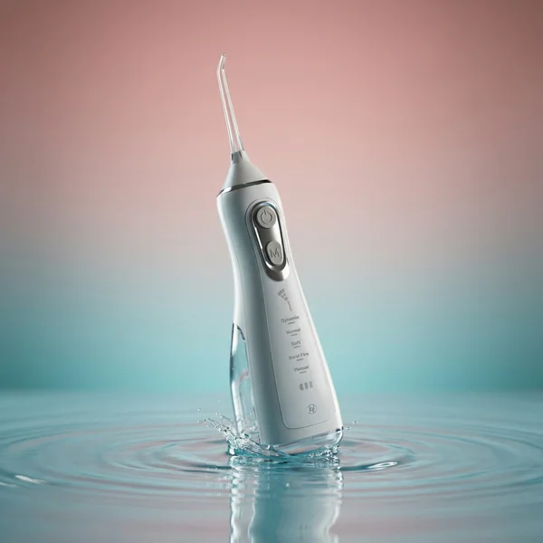 LUXE Intelligent Water Flosser with nozzle tips and charging cable